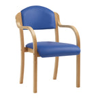 Wooden chair with blue vinyl seat and back on a white background