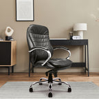 Black leather office chair in a modern office setting with a desk and decor.