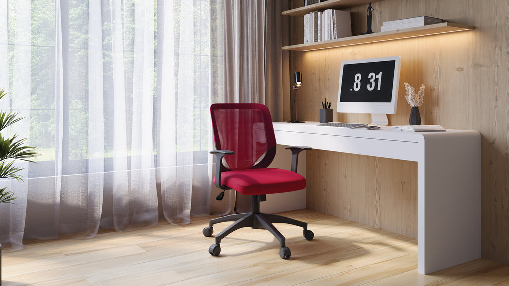 Modern home office with a red chair, white desk, and computer setup.