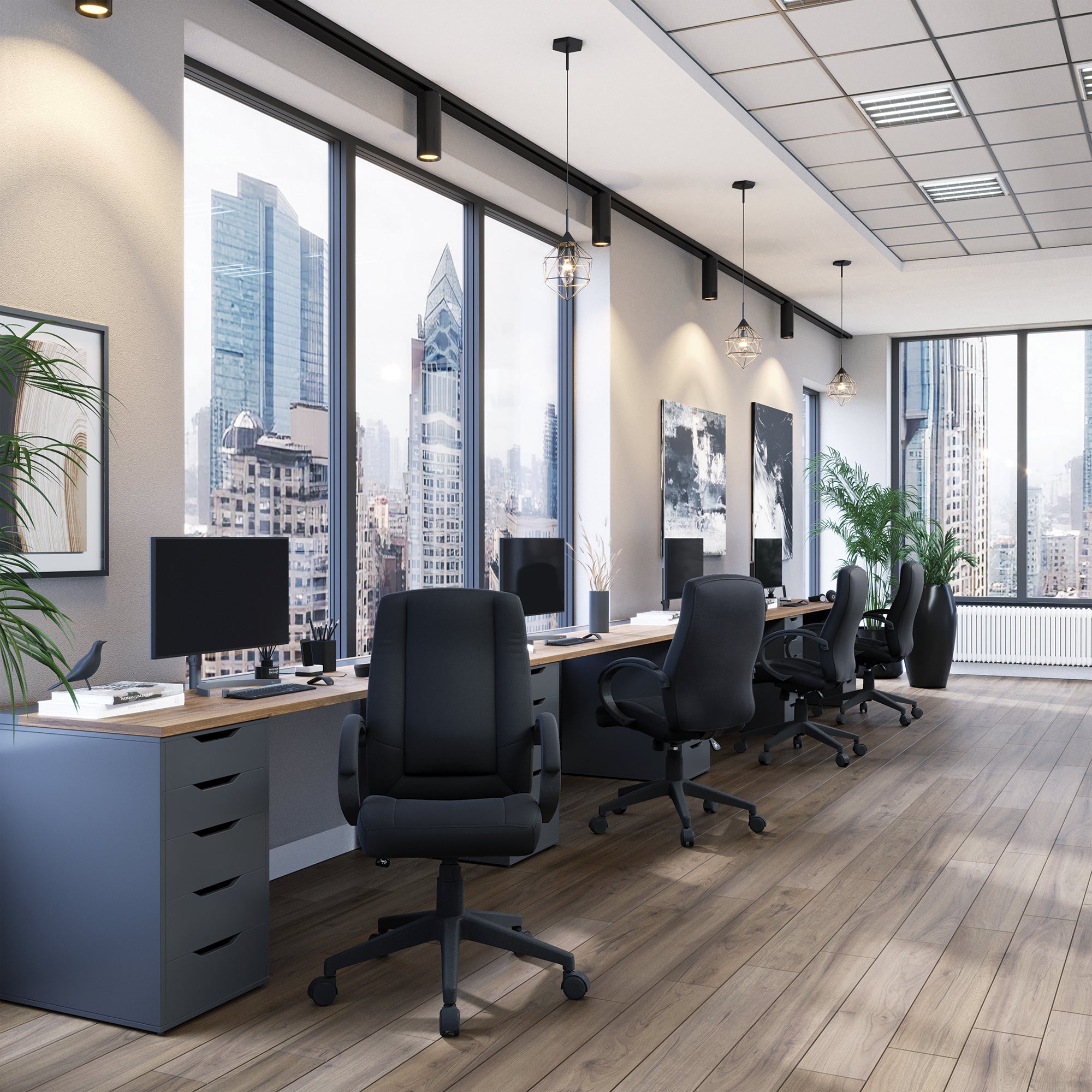 Modern office with desks, chairs, and large windows overlooking a cityscape.