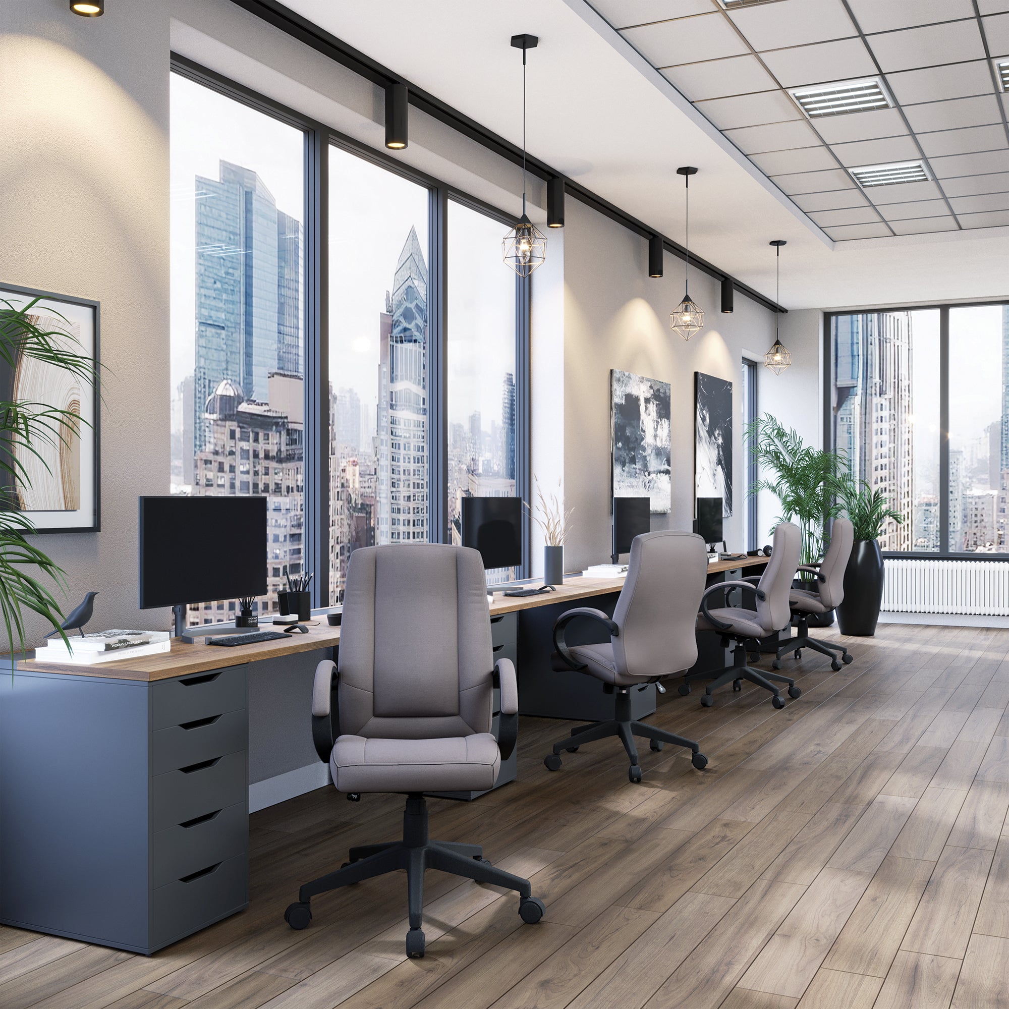 Modern office with desks, chairs, and large windows overlooking a cityscape.