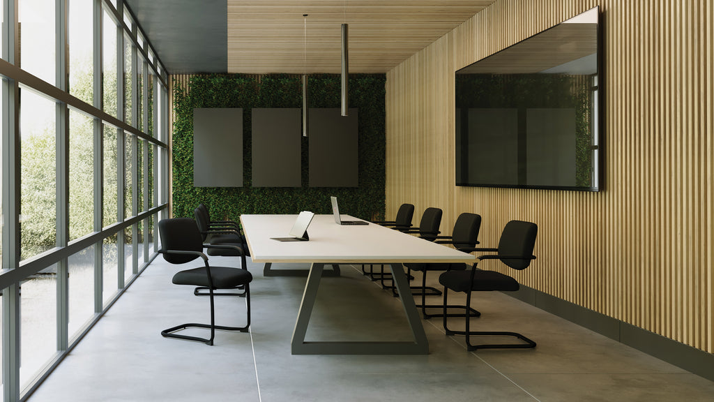 Modern conference room with a large table and chairs near large windows.