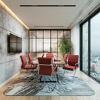 Modern conference room with red chairs, a table, and large windows overlooking a cityscape.
