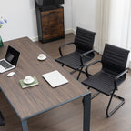 Office setup with a wooden desk, chairs, and office supplies.