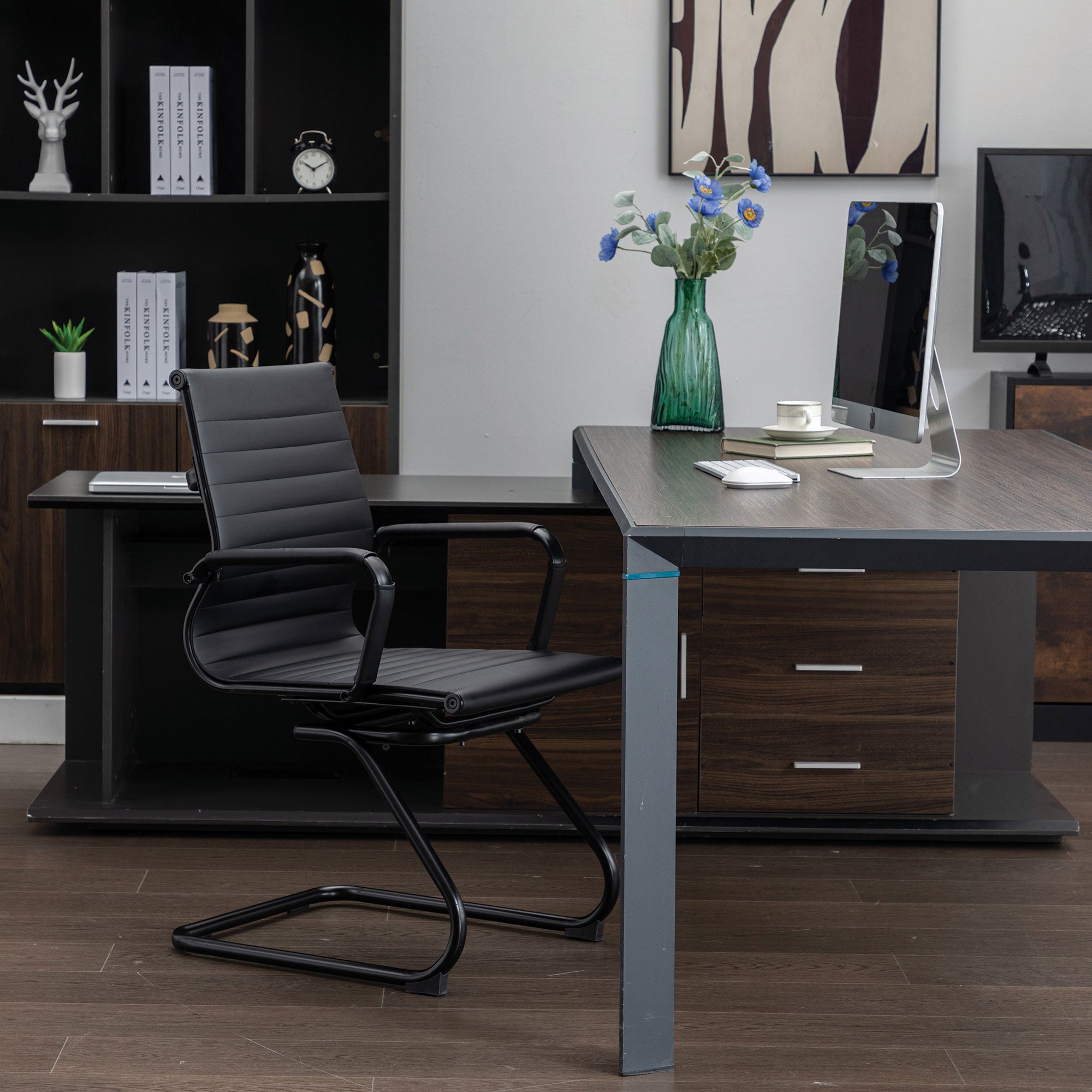 Modern office setup with a desk, chair, and computer equipment.