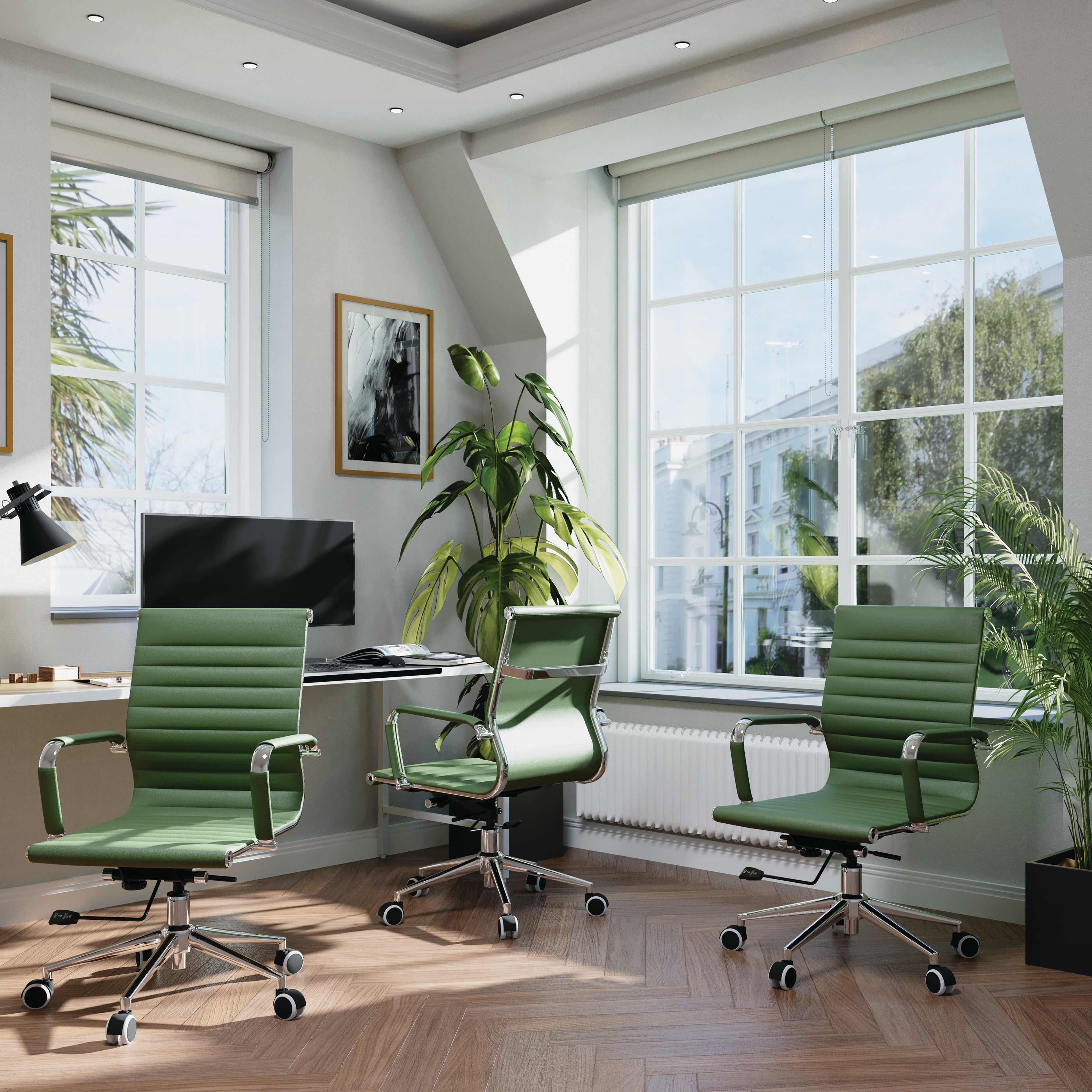 Modern office with green chairs, desk, and large windows.