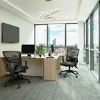Modern office setup with a desk, chairs, and city view