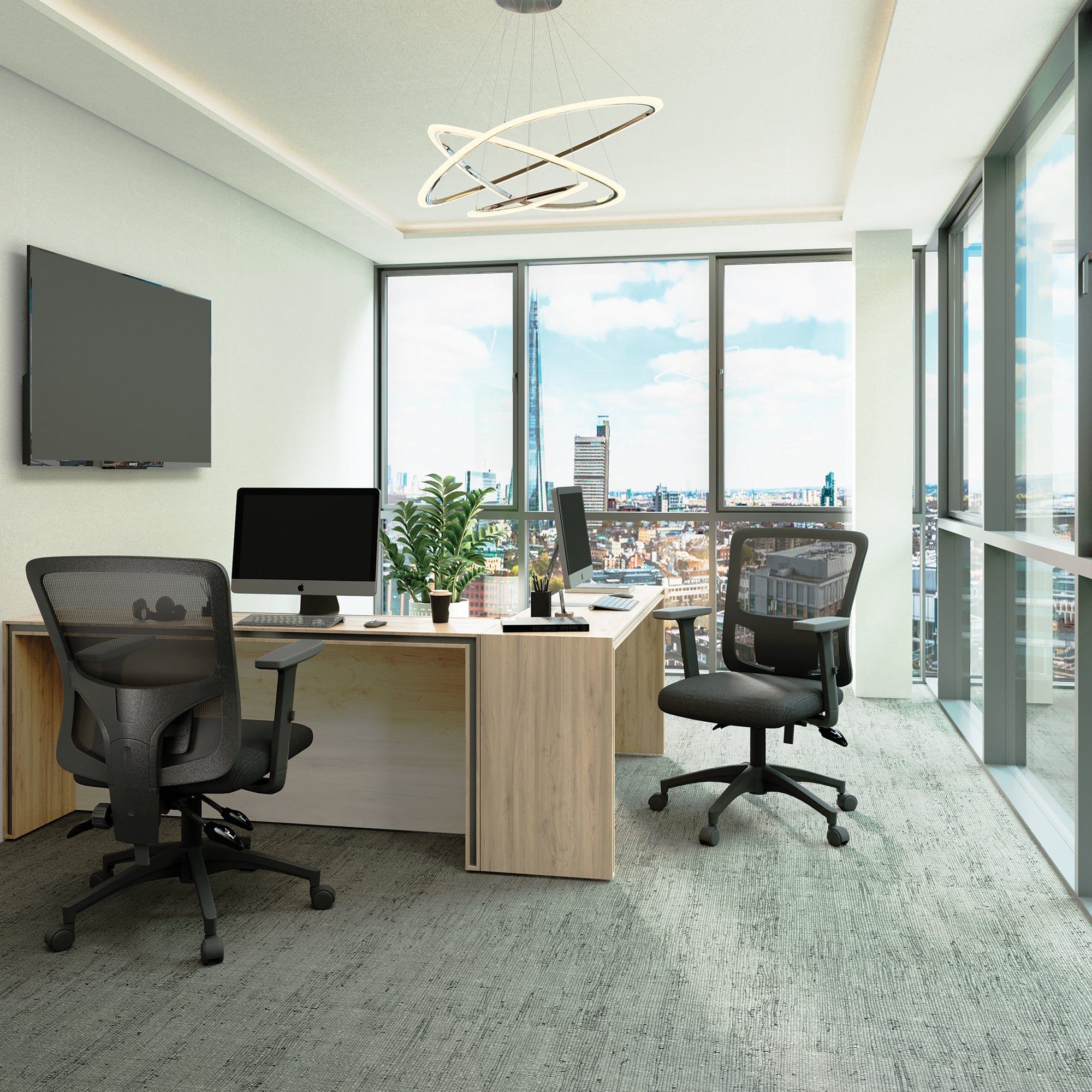 Modern office setup with a desk, chairs, and city view