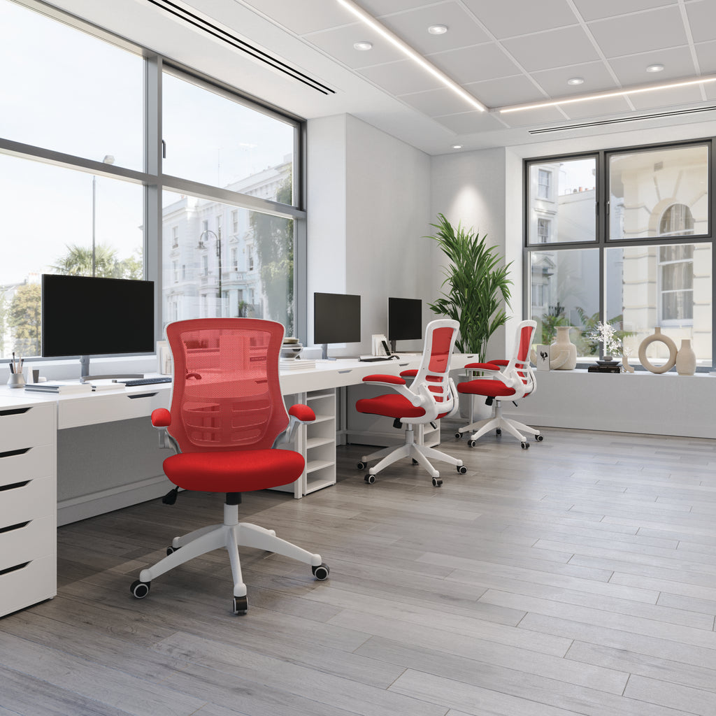 Modern office with red chairs and white desks