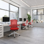 Modern office with red chairs and white desks
