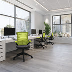 Modern office with green chairs and white desks