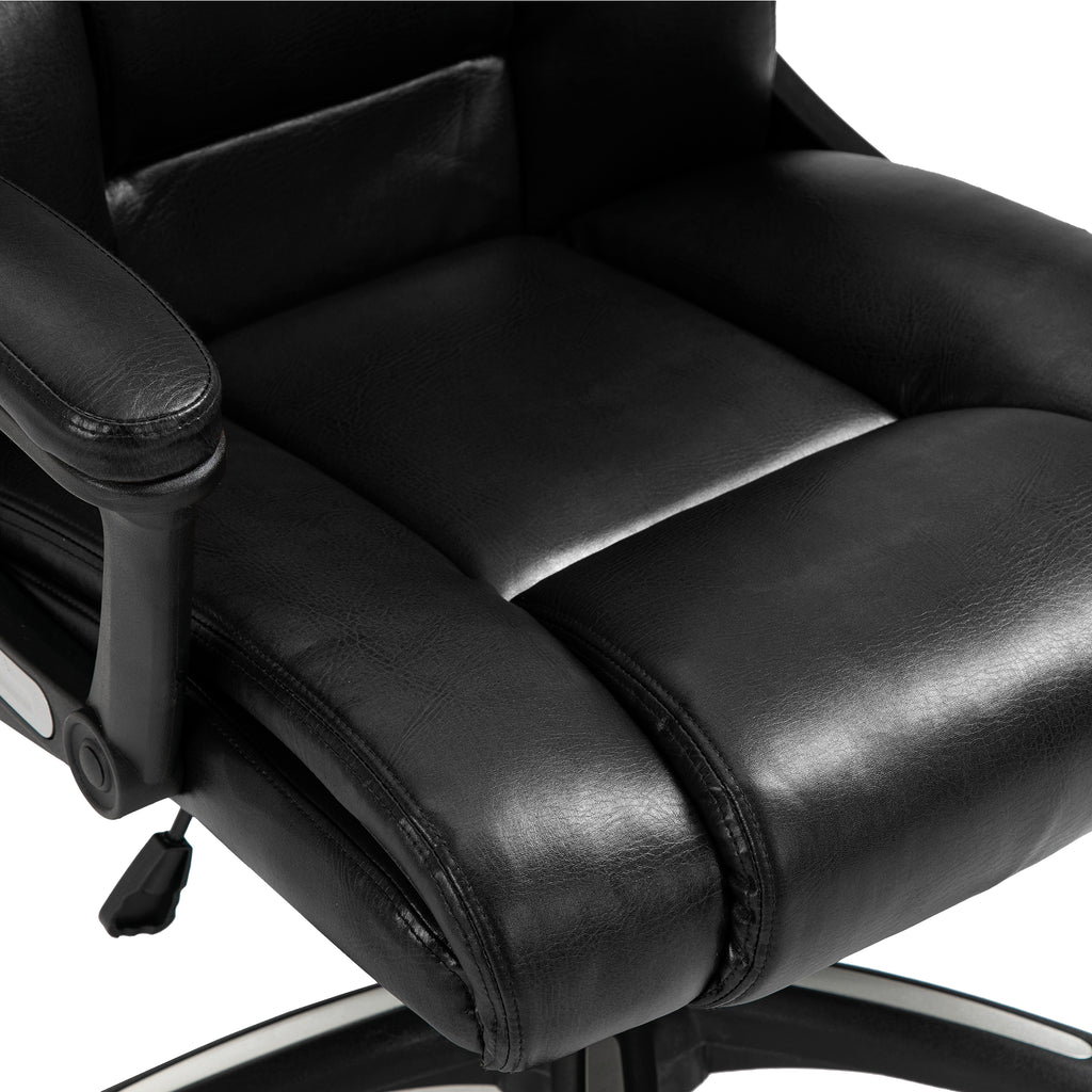 Close-up of a black office chair with leather seat and armrests on a white background