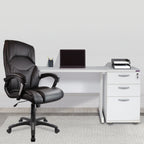 Black office chair in front of a white desk with a laptop and office supplies.