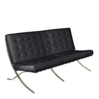 Black leather sofa with metal frame on a white background