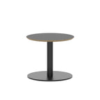 Small round black table with metal frame on a white background