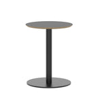 Round black table with metal frame on a white background