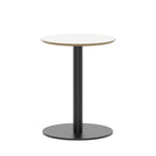 Round table with white top and black metal frame on a white background