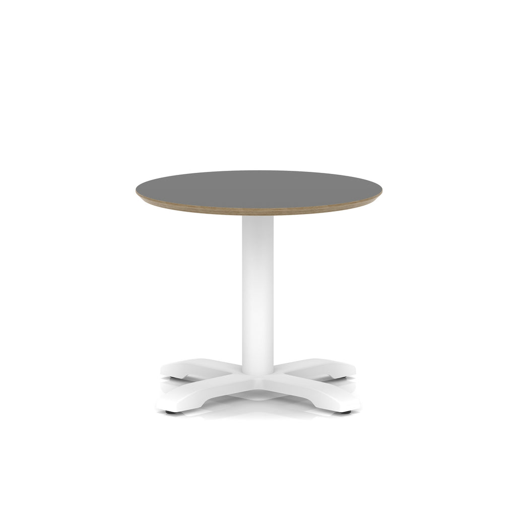 Small round table with black top and white metal frame on a white background