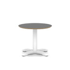 Small round table with black top and white metal frame on a white background