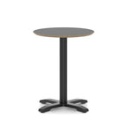 Round black table with metal frame on a white background