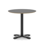 Round black table with metal frame on a white background