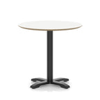 Round table with white top and black metal frame on a white background