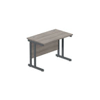Office desk with grey wood-effect top and grey legs on a white background