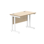 Office desk with wood-effect top and white legs on a white background