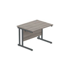Office desk with grey wood-effect top and grey legs on a white background