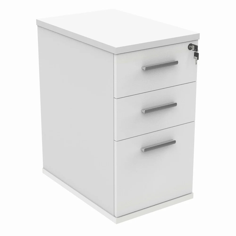 White pedestal with three drawers on a white background