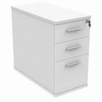 White pedestal with three drawers on a white background