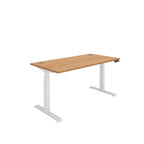 Height adjustable desk with wood-effect top and white frame on a white background