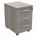 Grey wooden file cabinet with three drawers on wheels against a white background