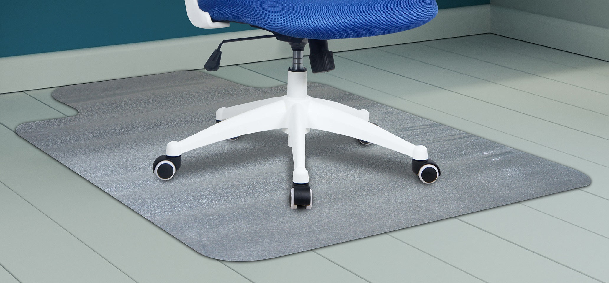 Chair on a grey office mat with a blue wall in the background