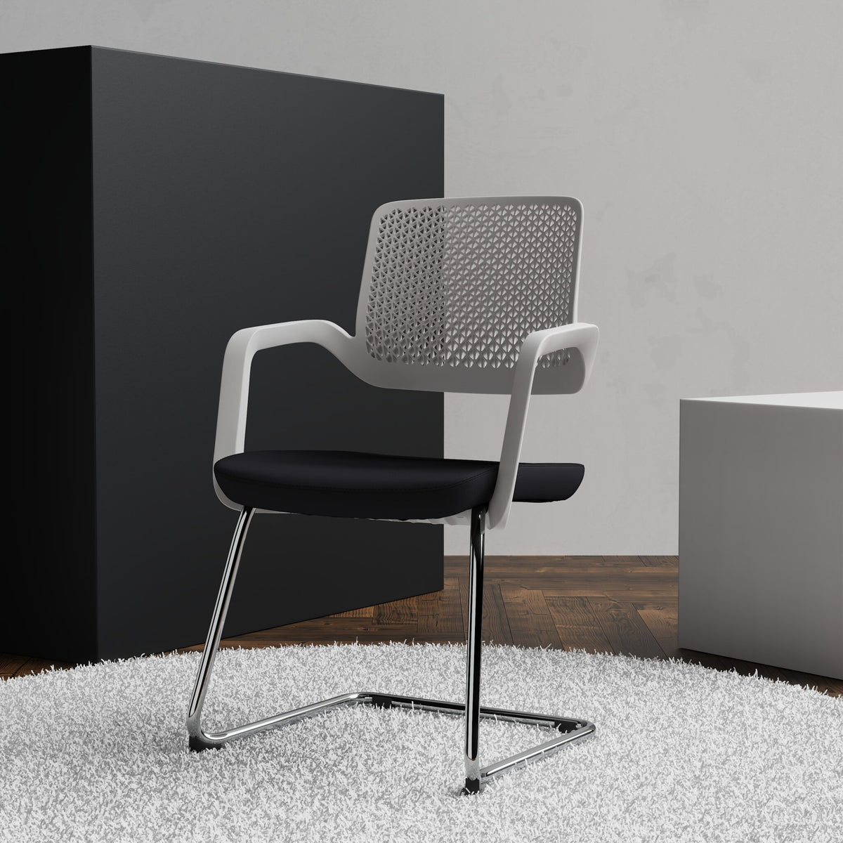 Black and white chair with cantilever frame on a white rug with blocks in the background