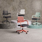 Four office chairs in different colours shown on a round pedestals with a grey wall in the background