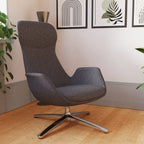 Modern high-back grey chair with metal frame shown in a room setting with paintings and plants in the background