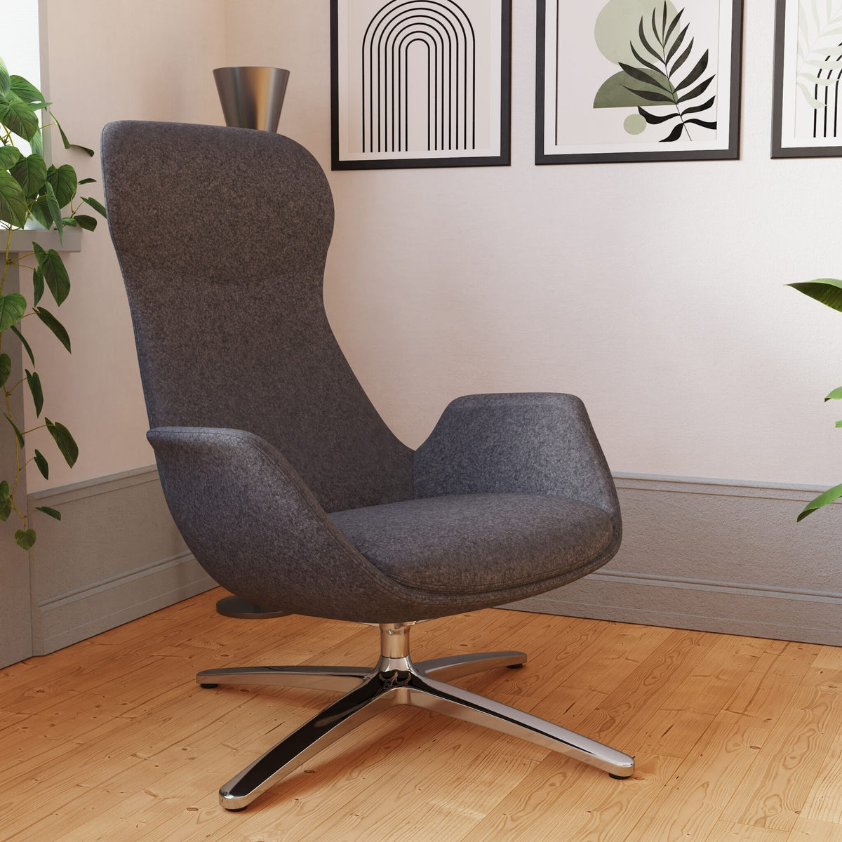 Modern high-back grey chair with metal frame shown in a room setting with paintings and plants in the background