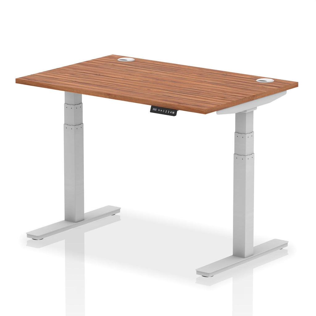 Adjustable height desk with wood-effect top and metal legs on a white background