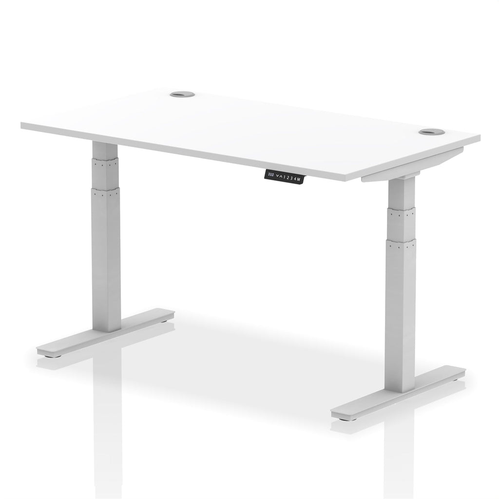 Adjustable height desk with white top and metal legs on a white background