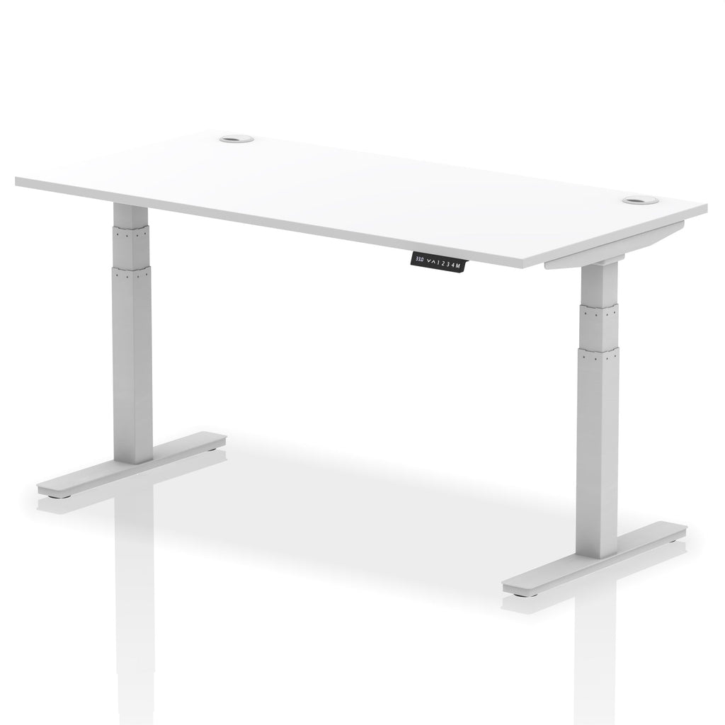 Adjustable height desk with white top and metal legs on a white background