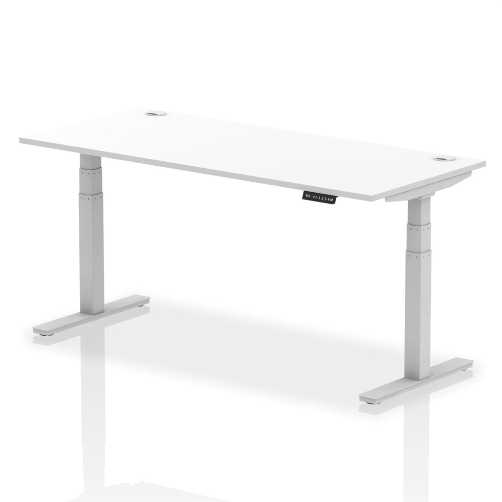 Adjustable height desk with white top and metal legs on a white background