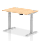 Adjustable height desk with wood-effect top and metal legs on a white background