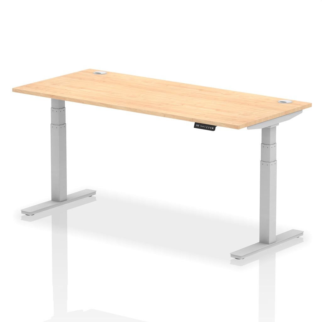 Adjustable height desk with wood-effect top and metal legs on a white background