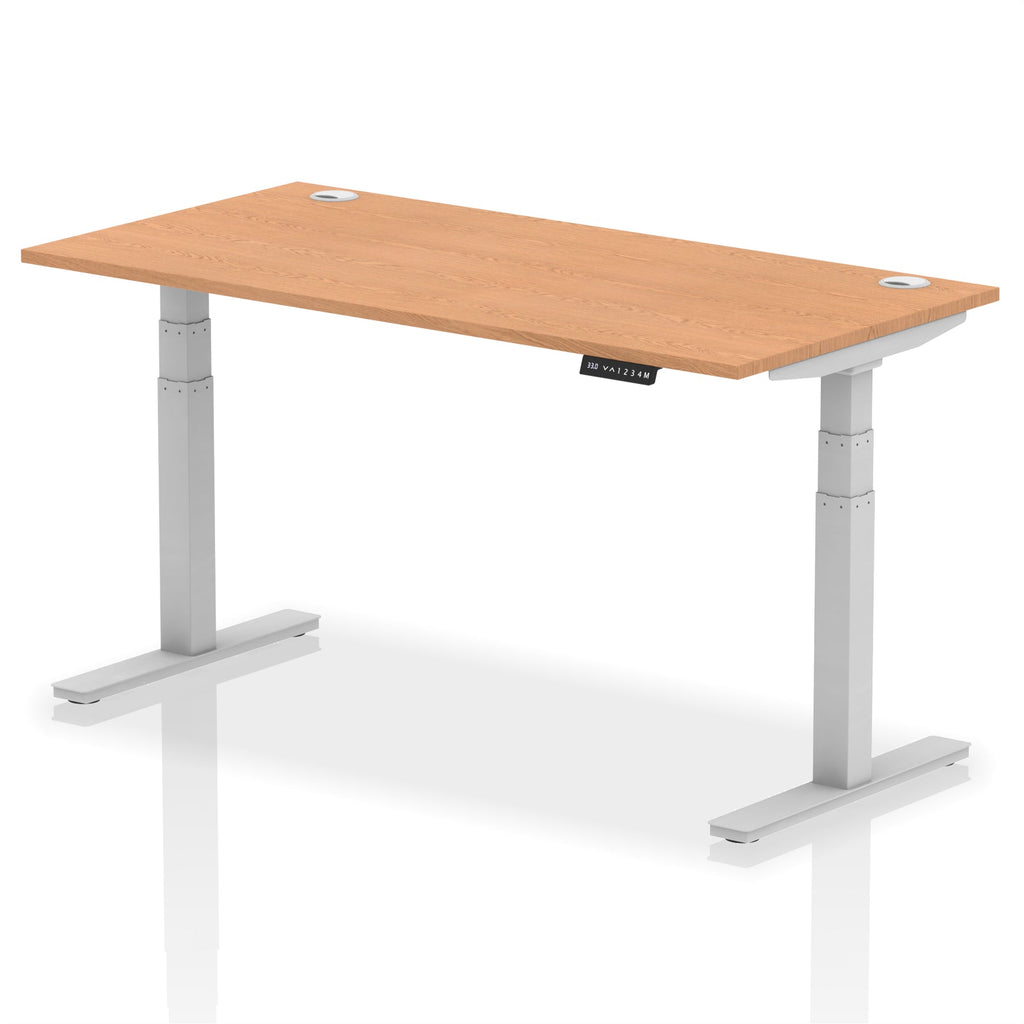 Adjustable height desk with wood-effect top and metal legs on a white background