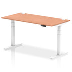 Adjustable height desk with wood-effect top and metal legs on a white background