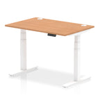 Adjustable height desk with wood-effect top and metal legs on a white background