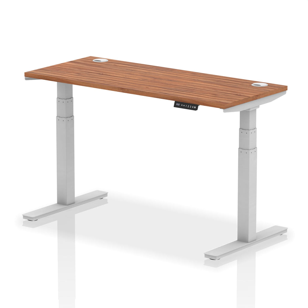 Adjustable height desk with wood-effect top and metal legs on a white background