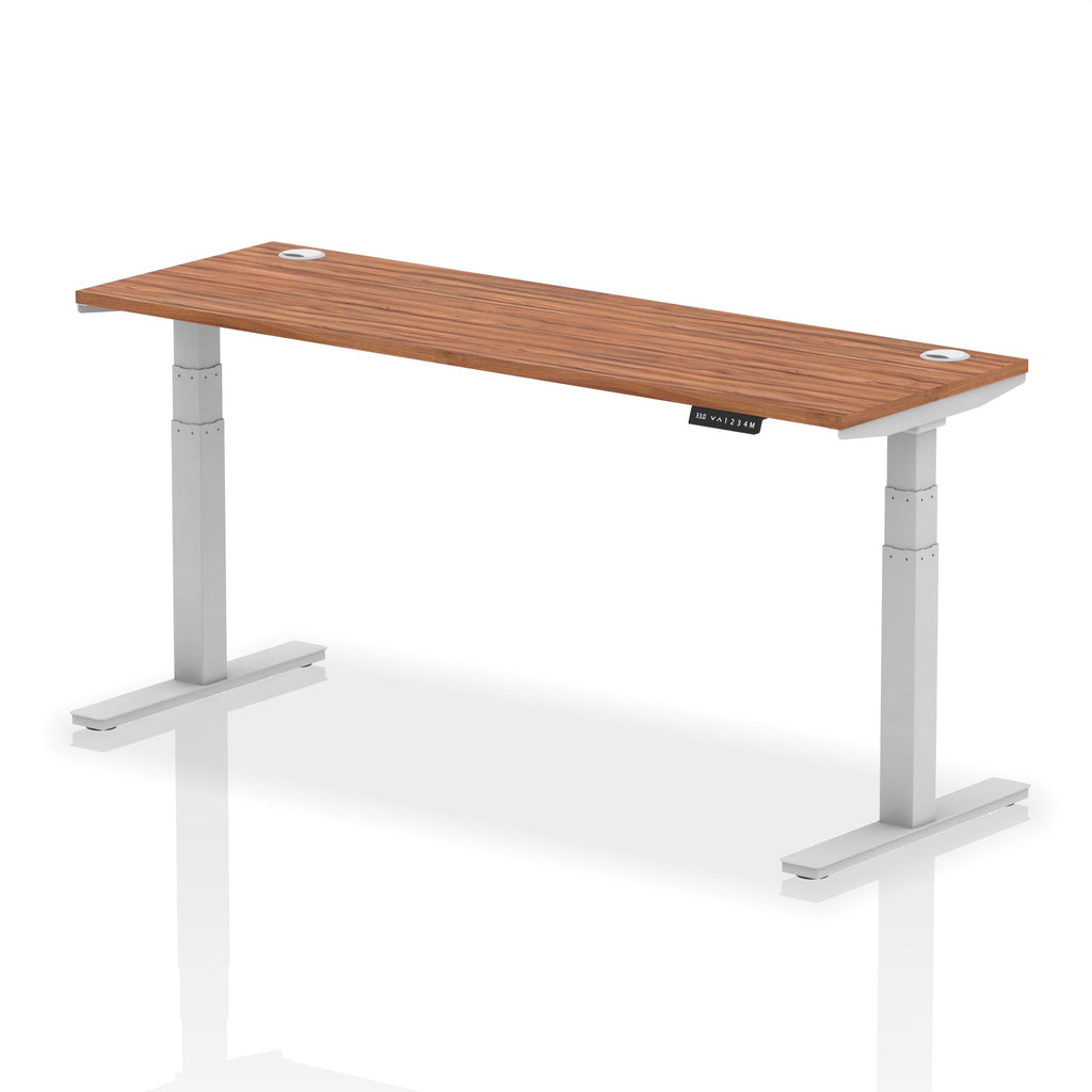 Adjustable height desk with wood-effect top and metal legs on a white background