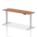 Adjustable height desk with wood-effect top and metal legs on a white background